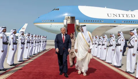 epa12099558 A handout photo made available by Qatar News Agency shows Qatar's Emir Sheikh Tamim bin Hamad al-Thani (R) welcoming US President Donald Trump upon his arrival in Doha, Qatar, 14 May 2025. EPA/QATAR NEWS AGENCY HANDOUT HANDOUT EDITORIAL USE ONLY/NO SALES