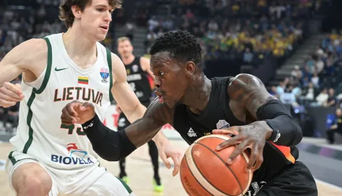 epa12335903 Ignas Sargiunas of Lithuania (L) and Dennis Schroder of Germany (R) in action during the FIBA EuroBasket 2025 group B basketball match between Lithuania and Germany, in Tampere, Finland, 30 August 2025. EPA/KIMMO BRANDT