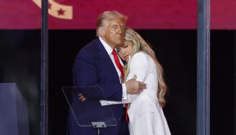 epaselect epa12396897 US President Donald Trump (L) and Erika Kirk (R), wife of Charlie Kirk, embrace on stage during the public memorial service of political activist Charlie Kirk at State Farm Stadium in Glendale, Arizona, USA, 21 September 2025. Kirk was shot and killed on 10 September during a stop on his American Comeback Tour organized by Turning Point USA at Utah Valley University. EPA/CAROLINE BREHMAN