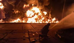 epa12311820 A handout photo provided by the State Emergency Service shows Ukrainian rescuers working at the site of a Russian strike on an infrastructure facility near Odesa, Ukraine, 18 August 2025 (issued 20 August 2025), amid the ongoing Russian invasion. At least one person was injured in a large fire at a fuel and energy infrastructure site, according to the State Emergency Service. EPA/STATE EMERGENCY SERVICE HANDOUT HANDOUT HANDOUT EDITORIAL USE ONLY/NO SALES