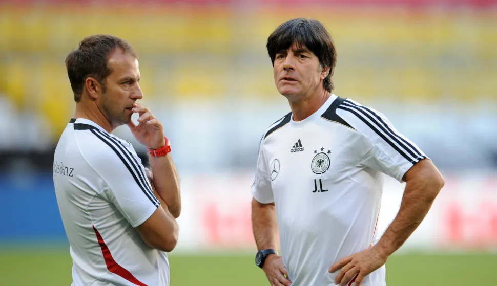 epa09226367 (FILE) - German national soccer team head coach Joachim Loew (R) and assistant coach Hansi Flick (L) lead their team's training session in Munich, Germany, 05 September 2013 (re-issued on 25 May 2021). Hansi Flick will become new head coach of the German national soccer team, the German Football Association (DFB) confirmed on 25 May 2021. Flick will succeed incumbent coach Joachim Loew after the UEFA EURO 2020 soccer championship. EPA/ANDREAS GEBERT GERMANY OUT *** Local Caption *** 50983253