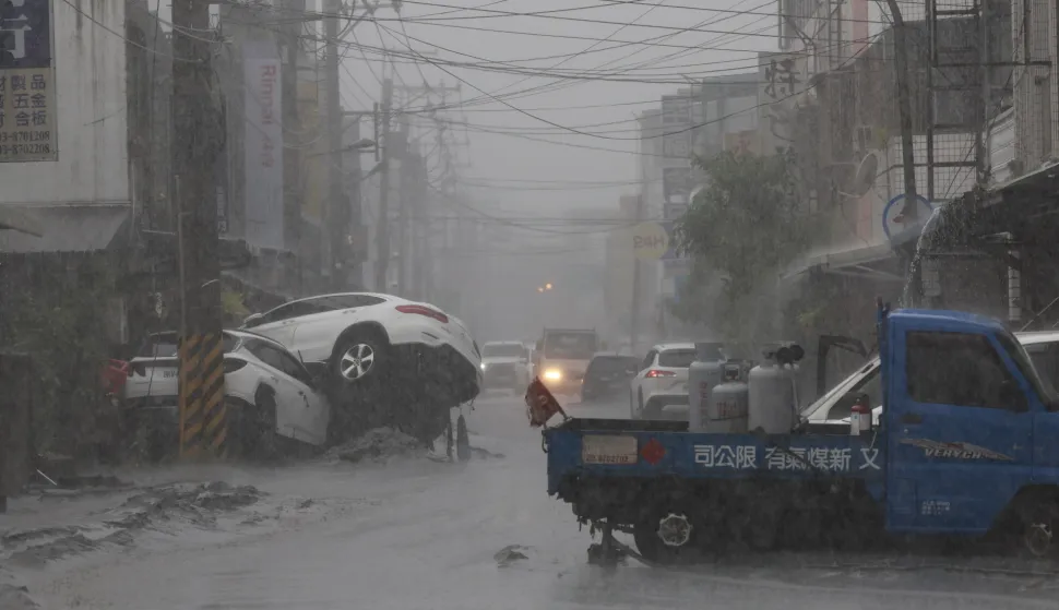 epa12401195 A view of damaged vehicles on the road in the aftermath of Super Typhoon Ragasa in Guangfu Township, Hualien County, Taiwan, 24 September 2025. At least 14 people have died, 32 were injured and more than 150 are missing in the eastern county after a barrier lake in the mountains overflowed and inundated the township during the typhoon, according to the Ministry of Health and Welfare. EPA/RITCHIE B. TONGO