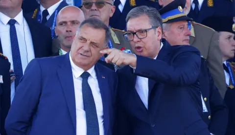 epa12392420 Serbian President Aleksandar Vucic (R) and disputed President of Republika Srpska Milorad Dodik (L) attend the 'Power of Unity' military parade marking Unity, Freedom and National Flag Day in Belgrade, Serbia, 20 September 2025. Around 6,000 troops took part alongside 4,000 in support roles, with new weapons and vehicles displayed. EPA/ANDREJ CUKIC