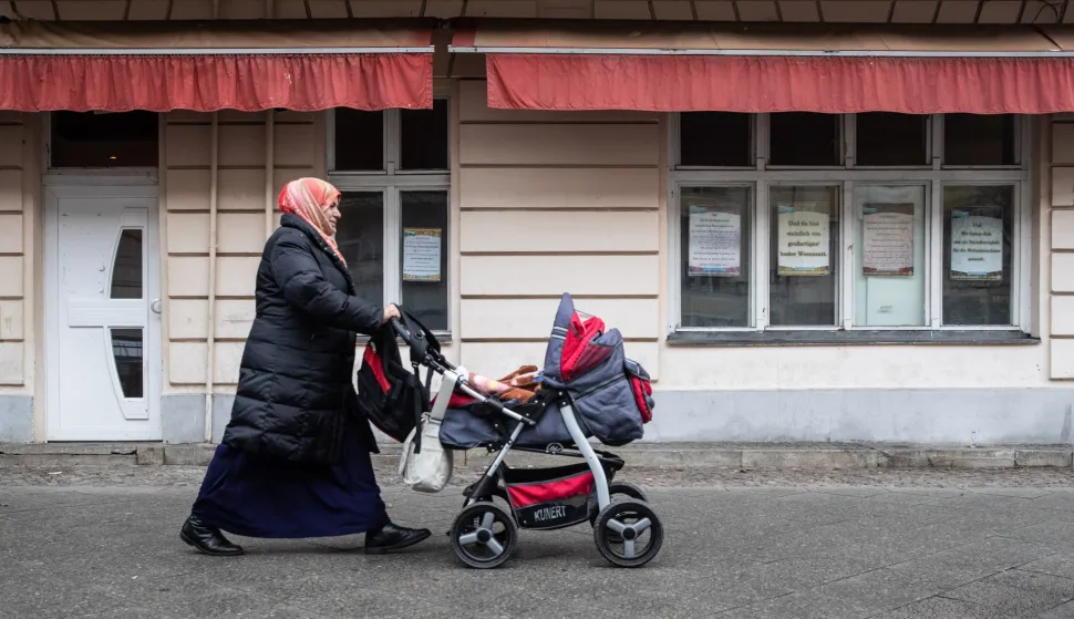 epa07238339 A woman walks in front of the As-Sahaba Mosque on the Torfstrasse in Berlin, Germany, 18 December 2018. According to police, detective officers searched the As-Sahaba mosque on the Torfstrasse and two or three apartments. The Mosque's Imam, 45, allegedly gives money to a jihadist fighters in Syria to purchase equipment for the commission of terrorist offenses, according to the prosecution. EPA/HAYOUNG JEON