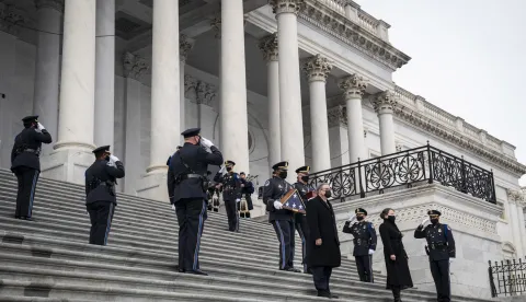 epa08984957 US Capitol Police officers carry the remains of Officer Brian Sicknick down the steps of the Capitol after laying in honor in the Rotunda in Washington, DC, USA, 03 February 2021. Officer Sicknick was responding to the riot at the US Capitol on 06 January 2021, when he was fatally injured while physically engaging with the mob. EPA/Drew Angerer/POOL
