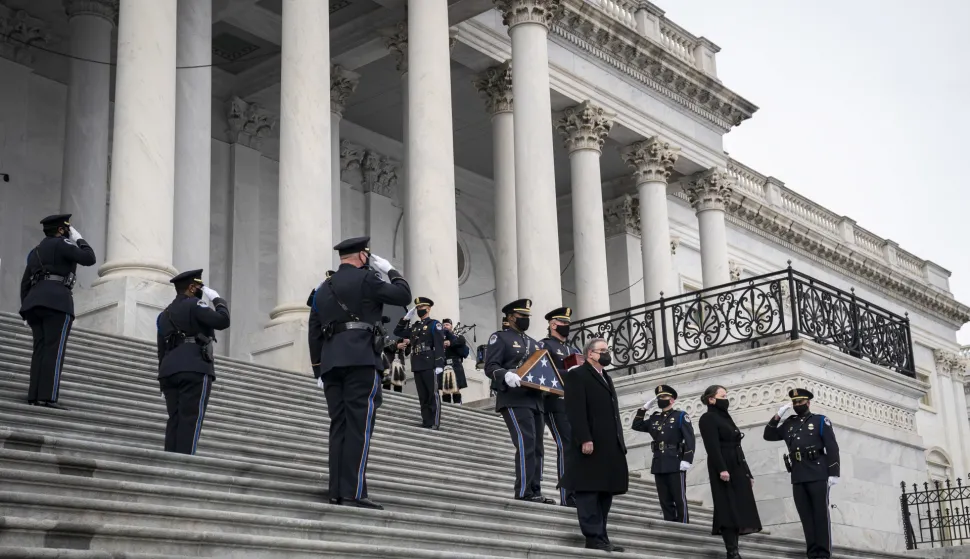epa08984957 US Capitol Police officers carry the remains of Officer Brian Sicknick down the steps of the Capitol after laying in honor in the Rotunda in Washington, DC, USA, 03 February 2021. Officer Sicknick was responding to the riot at the US Capitol on 06 January 2021, when he was fatally injured while physically engaging with the mob. EPA/Drew Angerer/POOL
