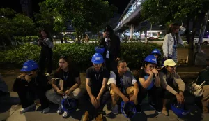 epa12418095 Filipino employees gather outside their office building after an earthquake in Ilo-Ilo city, Philippines, 30 September 2025. A magnitude 6.9 earthquake jolted Central Philippines according to the Philippine Institute of Volcanology and Seismology (Phivolcs). EPA/ARNOLD ALMACEN
