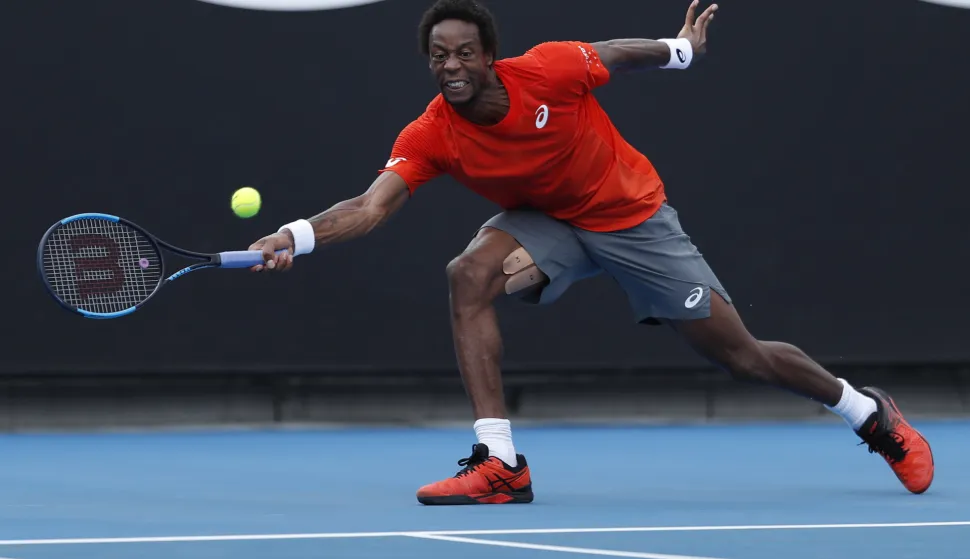 epa07288403 Gael Monfils of France in action against Taylor Fritz of the USA during their second round men's singles match at the Australian Open Grand Slam tennis tournament in Melbourne, Australia, 16 January 2019. EPA/RITCHIE TONGO