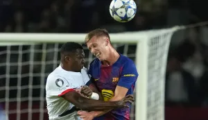 epa12421668 FC Barcelona's Dani Olmo (R) in action against PSG's Willian Pacho during the UEFA Champions League league phase soccer match between FC Barcelona and PSG, in Barcelona, Spain, 01 October 2025. EPA/Alejandro Garcia