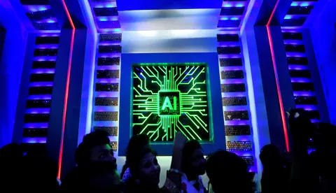 Visitors are seen inside of a Pandal (Temporary place for Worship) decorated with Artificial intelligence (AI) concept Theme during the Durga puja festival. Durga Puja also known as Durgotsava or Sharodotsav, is an annual festival originating in the Indian subcontinent which reveres and pays homage to the Hindu goddess Durga and is also celebrated because of Durga's victory over Mahishasura. (Photo by Avishek Das/SOPA Images/Sipa USA) Photo: SOPA Images/SIPA USA