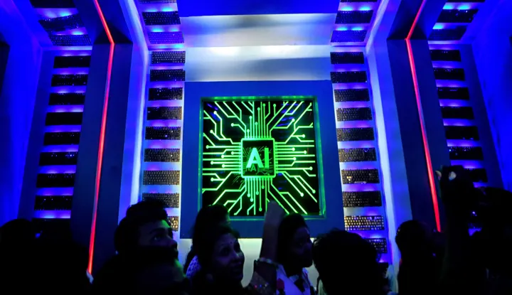 Visitors are seen inside of a Pandal (Temporary place for Worship) decorated with Artificial intelligence (AI) concept Theme during the Durga puja festival. Durga Puja also known as Durgotsava or Sharodotsav, is an annual festival originating in the Indian subcontinent which reveres and pays homage to the Hindu goddess Durga and is also celebrated because of Durga's victory over Mahishasura. (Photo by Avishek Das/SOPA Images/Sipa USA) Photo: SOPA Images/SIPA USA