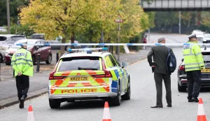 epa12423277 A police cordon in Manchester, Britain, 02 October 2025. Two people have died after a car and stabbing attack at a synagogue in Manchester. EPA/ADAM VAUGHAN