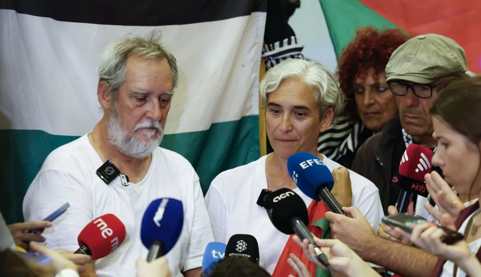 epa12433879 Barcelona's former Mayor Ada Colau (R) and ERC Councilor Jordi Coronas (L), two of the Spanish activists detained by Israeli forces as part of the Global Sumud Flotilla, speak to the media during their arrival at El Prat airport in Barcelona, Spain, 05 October 2025. EPA/TONI ALBIR