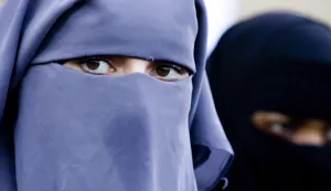 FILE - In this Nov. 30, 2006 file photo, unidentified women are seen wearing a niqab during a demonstration outside the Dutch parliament in The Hague, Netherlands. The Belgian parliament is likely to vote Thursday, April 29, 2010 on whether to ban face coverings worn by observant Muslim women. If passed, the ban would make Belgium the first country in Europe to outlaw the face coverings, which include both niqabs and burqas. (AP Photo/ Fred Ernst, File)