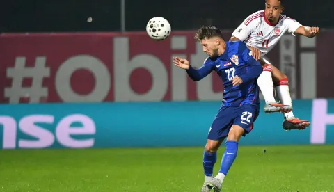 12.10.2025., stadion Varteks, Varazdin - Kvalifikacije za FIFA Svjetsko nogometno prvenstvo 2026., skupina L, Hrvatska - Gibraltar. Marco Pasalic i Carlos Richards Photo: Vjeran Zganec Rogulja/PIXSELL