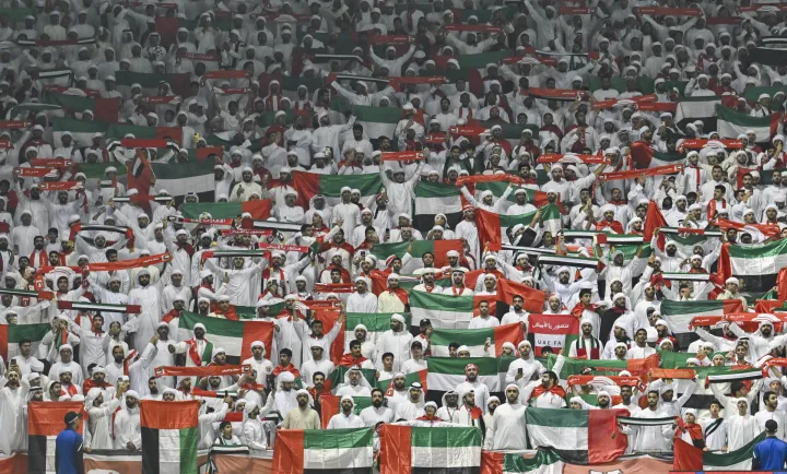 (251015) -- DOHA, Oct. 15, 2025 (Xinhua) -- Supporters of United Arab Emirates cheer for the team during the FIFA World Cup 2026 AFC Asian Qualifiers group A playoffs match between Qatar and United Arab Emirates in Doha, Qatar, Oct. 14, 2025. (Photo by Nikku/Xinhua) Photo: Nikku/XINHUA