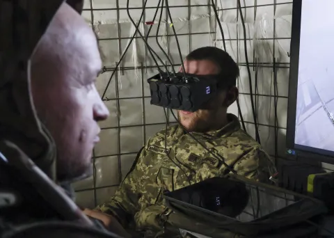 epa12440289 A handout picture made available by the press service of the 65th Separate Mechanised Brigade of Ukrainian Armed Forces shows the pilot of an air defense crew controls an interceptor drone from their position in the Zaporizhzhia region, Ukraine, 08 October 2025, amid the ongoing Russian invasion. Ukrainian interceptor drones work against different Russian drones the such as reconnaissance drones, FPV, and others, which are the main threat to military and civilians on the territory close to the frontline. EPA/Press service of the 65th Mechanized Brigade/HANDOUT HANDOUT EDITORIAL USE ONLY/NO SALES