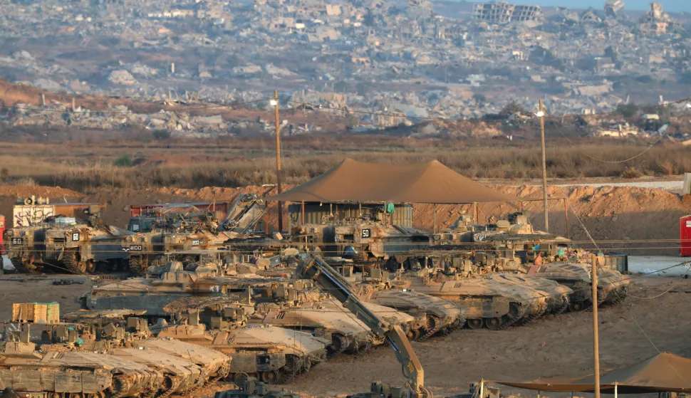 epa12469121 Israeli tanks gathered at an undisclosed location near the border with the Gaza Strip in southern Israel, 21 October 2025. As part of an Israel-Hamas ceasefire agreement, the Israeli military partially withdrew from Gaza on 10 October. EPA/ATEF SAFADI