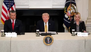 epa12476782 US Secretary of Defense Pete Hegseth (L) and Attorney General Pam Bondi (R) listen to President Donald Trump (C) speak during a roundtable with the Homeland Security Task Force in the State Dining Room of the White House in Washington, DC, USA, 23 October 2025. EPA/WILL OLIVER/POOL POOL