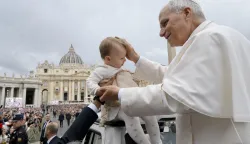 epa12472243 A handout picture provided by the Vatican Media shows Pope Leo XIV blessing a child during the general audience, in St. Peter's Square in the Vatican, 22 October 2025. EPA/VATICAN MEDIA HANDOUT HANDOUT EDITORIAL USE ONLY/NO SALES