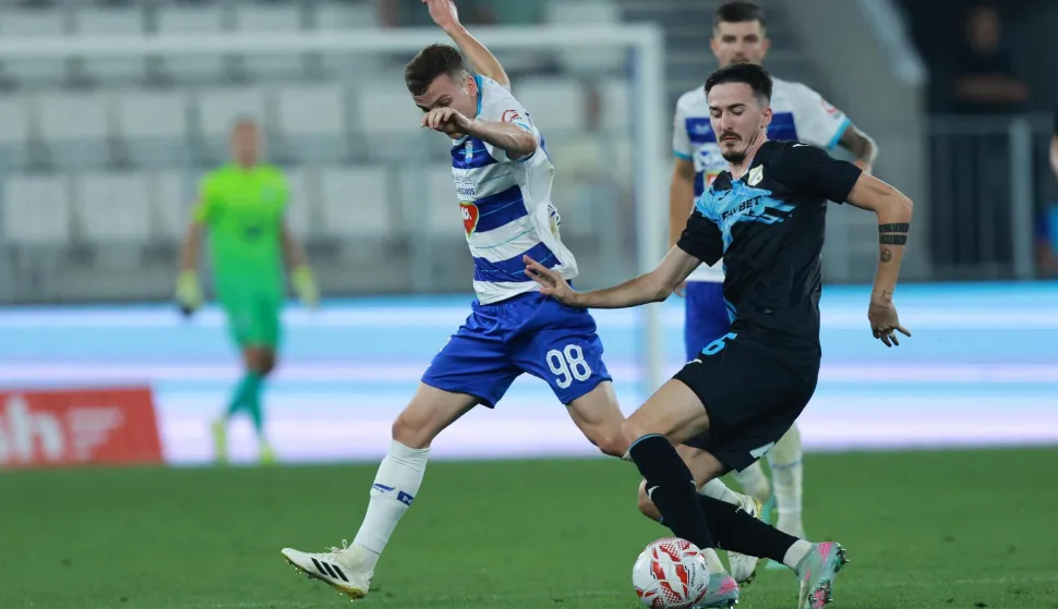 09.08.2025., stadion Opus Arena, Osijek - SuperSport HNL, 02. kolo, NK Osijek - HNK Rijeka. Simun Mikolcic i Stjepan Radeljic Photo: Davor Javorovic/PIXSELL