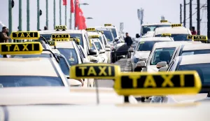 epa07495883 Taxi drivers drive slowly on a street during their nationwide protest in Cologne, Germany, 10 April 2019. Germany's Federal Ministry of Transport is planning to change the law to liberalize the market and remove essential requirements for alternatives such as Uber. EPA/SASCHA STEINBACH