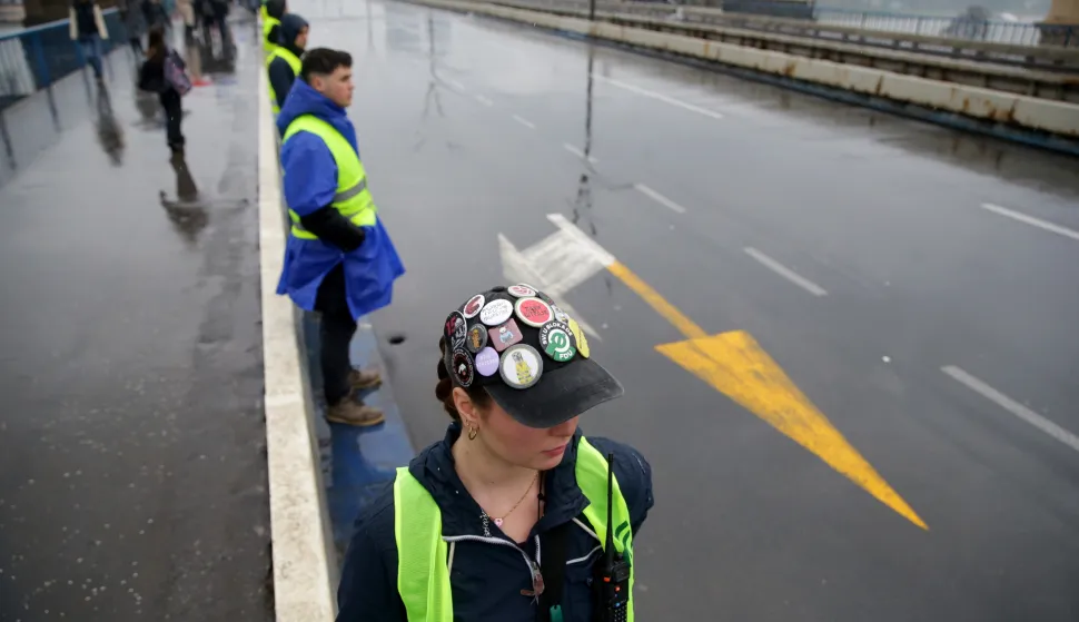 epaselect epa11989808 University students stage a blockade of the Brankova street bridge in Belgrade, Serbia, 26 March 2025. The students staged the protest, demanding accountability after fifteen people lost their lives in the collapse of the Novi Sad Railway Station canopy on 01 November 2024. The station building, which had been renovated and reopened on 05 July 2024, was undergoing further renovations shortly before the collapse. EPA/ANDREJ CUKIC