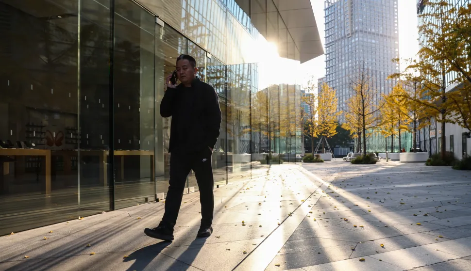 epa12500165 A man walks in Beijing's Central Business District, China, 03 November 2025. EPA/WU HAO