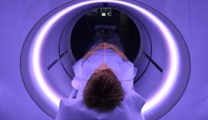 epa05113152 An x-ray assistant lies in a CT scanner for purposes of demonstration in the emergency room of the University Hospital (UKJ) in Jena, Germany, 20 January 2016. The UKJ is the first hospital in Germany to employ a new kind of CT scanner in the emergency room. Various steps of treatment can be performed through with a single scan, while simultaneously reducing radiation exposure for the patient. The GE Healthcare scanner is called the 'Revolution CT.'  EPA/MARTIN SCHUTT