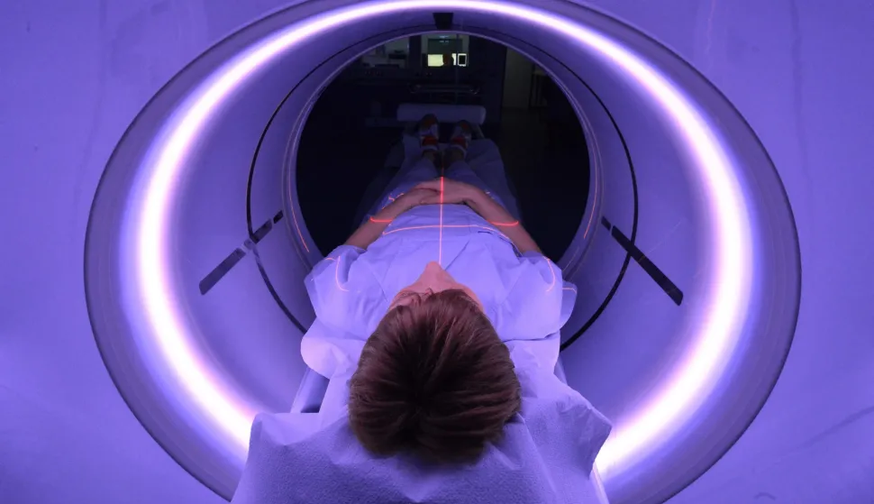 epa05113152 An x-ray assistant lies in a CT scanner for purposes of demonstration in the emergency room of the University Hospital (UKJ) in Jena, Germany, 20 January 2016. The UKJ is the first hospital in Germany to employ a new kind of CT scanner in the emergency room. Various steps of treatment can be performed through with a single scan, while simultaneously reducing radiation exposure for the patient. The GE Healthcare scanner is called the 'Revolution CT.'  EPA/MARTIN SCHUTT