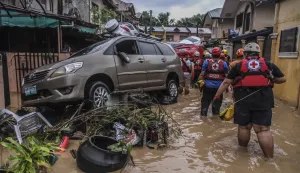 epaselect epa12501755 Emergency responders enter a flooded street in a residential district affected by typhoon Kalmaegi, in Cebu City, Philippines, 04 November 2025. Typhoon Kalmaegi crossed the Visayas region of central Philippines on 04 November, causing flooding, power outtages and damage to property. According to the Philippine Atmospheric, Geophysical, and Astronomical Services Administration (PAGASA), the typhoon is projected to be in the vicinity of Negros Occidental province in the central Philippines, moving west at 25 kilometers per hour with maximum winds of 140 kilometers per hour. EPA/JUANITO ESPINOSA