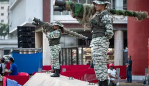epa12494378 Members of Venezuela's Bolivarian Militia stand guard during a pro-government demonstration in Caracas, Venezuela, 30 October 2025. Supporters of President Nicolas Maduro marched against the US military deployment in the Caribbean Sea, which Washington says targets drug trafficking. Maduro claims the mission is a cover to remove him from power. EPA/RONALD PENA R