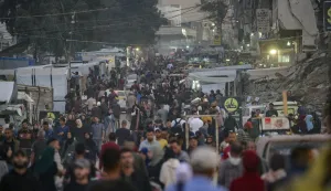 epa12520927 Palestinians walk through the streets of Al Remal neighborhood in Gaza City, Gaza Strip, 12 November 2025, amid a ceasefire between Israel and Hamas. According to the UN around 90 percent of the population or 1.9 million people in Gaza have been displaced since the start of the conflict. EPA/MOHAMMED SABER