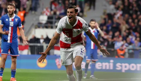 Rijeka, 14.11.2025 - Utakmica kvalifikacija za nogometno SP 2026. Hrvatska - Farski otoci na stadionu Rujevica u Rijeci. Na slici Petar Musa slavi postignuti pogodak. foto HINA/ Damir SEN?AR/ ds