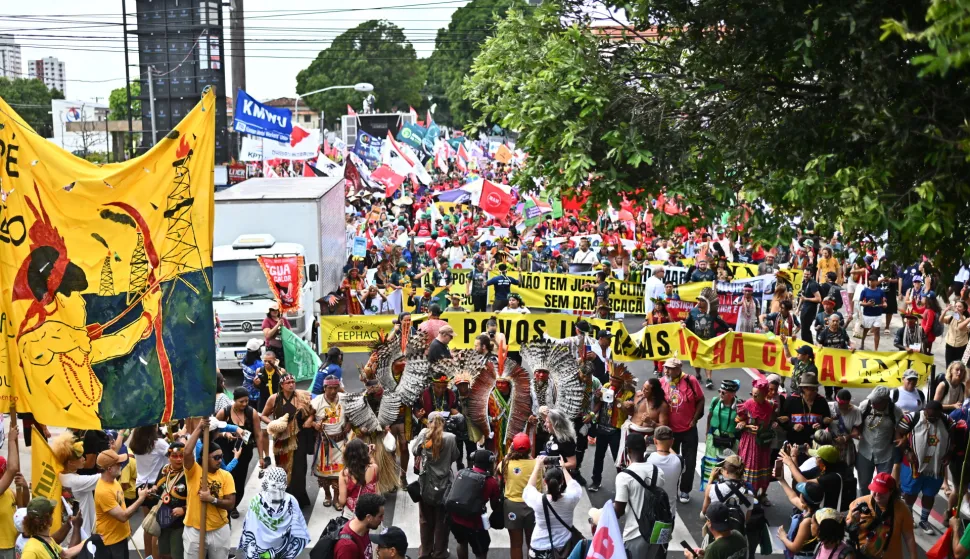 epa12527983 People join the Global Climate March in Belem, Brazil, 15 November 2025, calling on governments to protect forests, uphold indigenous rights, and take global climate action during the COP30 summit. EPA/ANDRE BORGES