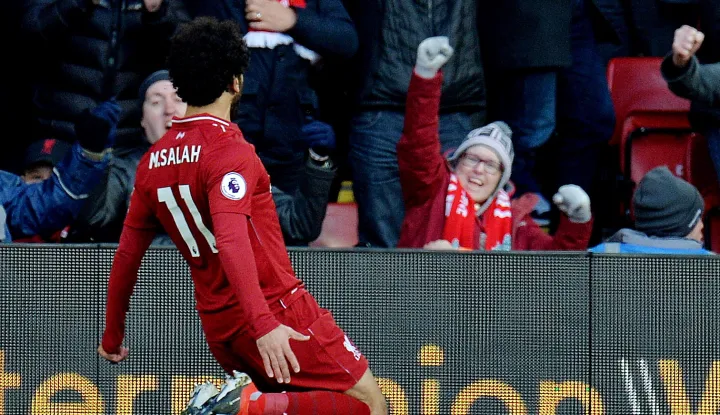 epa07158089 Liverpool's Mohamed Salah celebrates scoring the first goal during the English Premier League soccer match between Liverpool and Fulham at the Anfield in Liverpool, Britain, 11 November 2018. EPA/PETER POWELL EDITORIAL USE ONLY. No use with unauthorized audio, video, data, fixture lists, club/league logos or 'live' services. Online in-match use limited to 75 images, no video emulation. No use in betting, games or single club/league/player publications