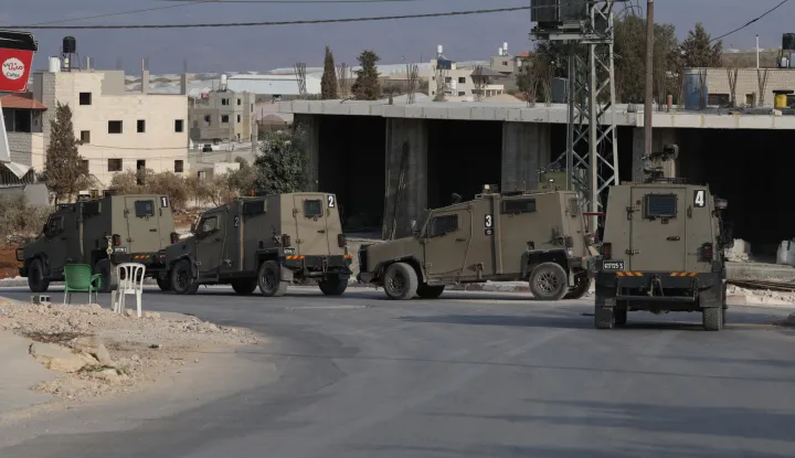 epa12502793 Israeli troops patrol during an army operation in Tamoun near Tubas city, West Bank, 04 November 2025. According to the Palestinian news agency Wafa, Israeli forces raided Tamoun, imposed a siege on the western area of the town, and arrested four Palestinians. EPA/ALAA BADARNEH