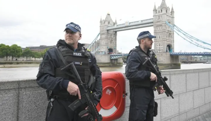 epa06369453 (FILE) - British police on dutyl during a vigil for the victims of the London Bridge terror attacks by the City Hall in London, Britain, 05 June 2017, (reissued 05 December 2017). Media reports on 05 December 2017 state that the report by David Anderson QC, a former terrorism law reviewer asked by the British Home Secretary to audit internal MI5 and police reviews, is published on 05 December 2017. The terror attacks in 2017 - at Manchester Arena, London Bridge, Finsbury Park and Westminster - has placed the spotlight on the British security services. The British internal security service MI5 and police launched internal reviews following the atrocities between March and June 2017 and the findings of the reviews looking at intelligence handling by the organisations are to be seen in the review published by the Home Secretary. EPA/FACUNDO ARRIZABALAGA *** Local Caption *** 53568746