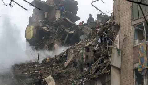 epa12537303 Ukrainian rescuers work at the site of a Russian strike on a high-rise residential building in Ternopil, western Ukraine, 20 November 2025, amid the Russian invasion. At least 26 people were killed, including three children, and 93 others, including 18 children, were injured in Ternopil after Russian forces launched overnight strikes across Ukraine on 19 November, involving over 470 drones and 48 missiles, Ukrainian authorities reported. EPA/MAXYM MARUSENKO