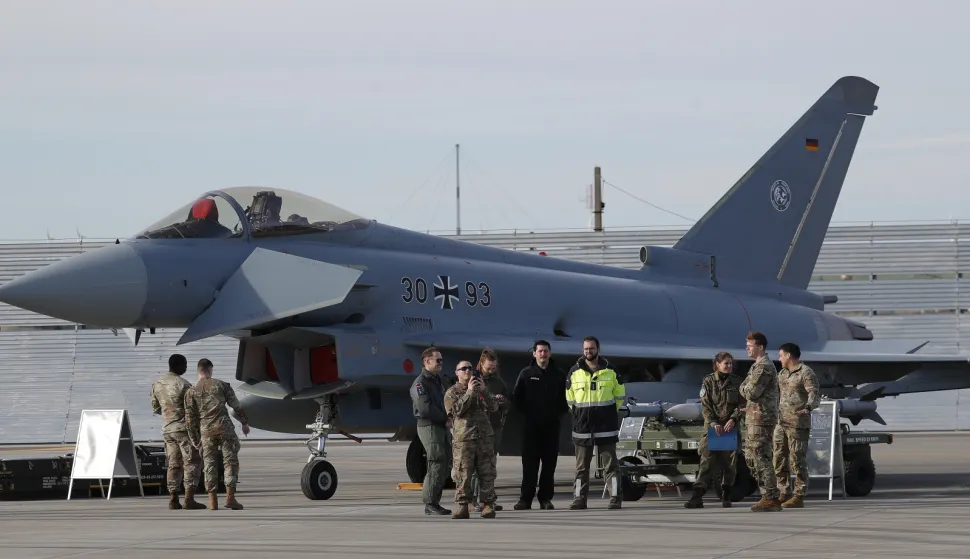 epa12547651 A German Eurofighter Typhoon airplane, surrounded by German military personnel is set on display prior to the U.S. Army Europe and Africa Commanding General Gen. Christopher Donahue visit to the US Army garrison Black Sea, at the 57-th military airbase Mihail Kogalniceanu, near Constanta city, Romania, 25 November 2025. Two German Eurofighter Typhoons and two Romanian F-16s were scrambled this morning after radars detected two targets violating Romanian airspace. The Ministry of Defense later confirmed that one target, an unarmed drone, was found crashed in Vaslui County, about 50 km from the border with the Republic of Moldova. Romanian Defense Minister Ionut Mosteanu called the incident a "new Russian provocation against Romania." EPA/ROBERT GHEMENT