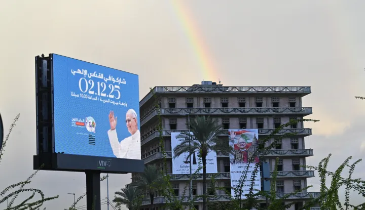 epa12561376 A rainbow is visible near a billboard advertising the visit of Pope Leo XIV, in Beirut, Lebanon, 01 December 2025. Pope Leo XIV is on his first apostolic visit outside Italy since his election as pontiff. He visited Turkey from 27 November and continues his journey to Lebanon from 30 November until 02 December. EPA/WAEL HAMZEH