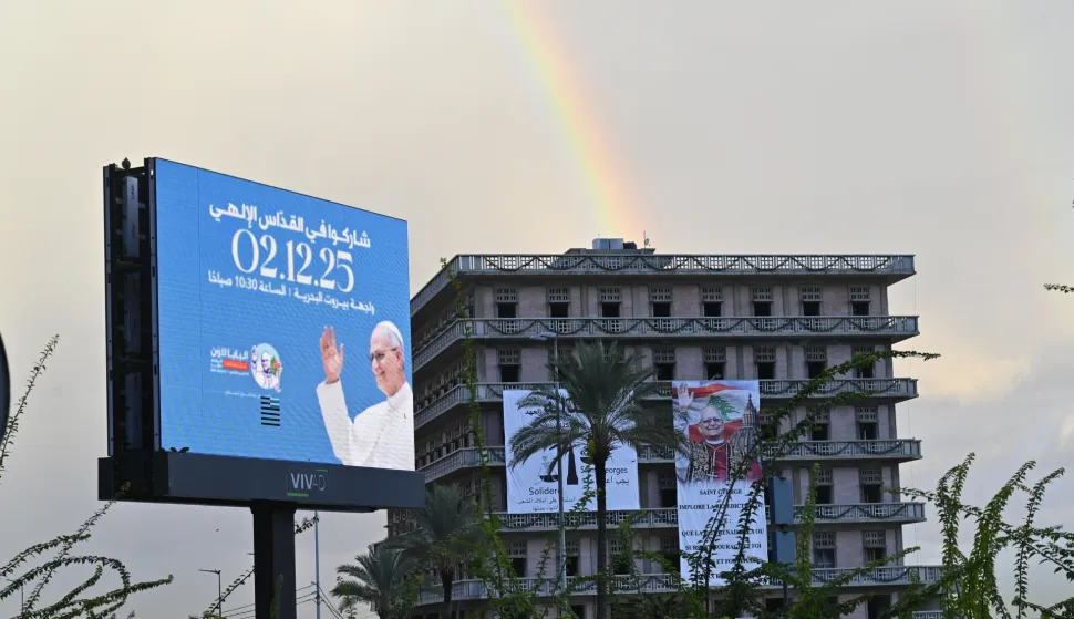 epa12561376 A rainbow is visible near a billboard advertising the visit of Pope Leo XIV, in Beirut, Lebanon, 01 December 2025. Pope Leo XIV is on his first apostolic visit outside Italy since his election as pontiff. He visited Turkey from 27 November and continues his journey to Lebanon from 30 November until 02 December. EPA/WAEL HAMZEH