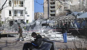 epa11907056 Local people stand near a damaged area after drone strikes hit Odesa, southwestern Ukraine, 19 February 2025, amid the Russian invasion. At least four people were injured, including a child, in Odesa as a result of an overnight Russian drone attack, the head of the Odesa Regional Military Administration, Oleh Kiper, wrote on telegram. Civilian infrastructure objects, including a children's clinic, a kindergarten, windows in high-rise buildings and cars, were damaged in the attack. EPA/IGOR TKACHENKO