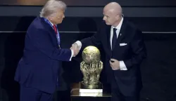 epa12572600 US President Donald Trump (L) receives the FIFA Peace Prize from FIFA President Giovanni Infantino during the FIFA World Cup 2026 Final Draw at the Kennedy Center in Washington DC, USA, 05 December 2025. EPA/SHAWN THEW