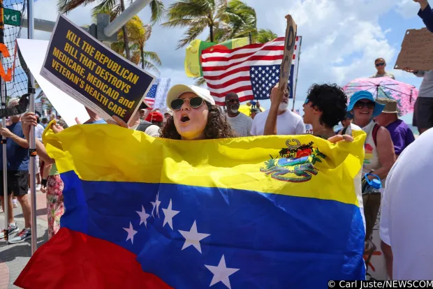 Maria waves the Venezuela flag as she protest in behalf of her country-persons being returned as protesters line A1A chants of discontent during the national "No Kings Days" in Fort Lauderdale. At its peak between 400-500 peaceful protestors gathered at Fort Lauderdale's No Kings Protest on the A1A and Sunrise Boulevard Saturday. The rally was just one of hundreds being held across the country on the birthday of President Trump, Saturday, June 14, 2025. (Carl Juste/Miami Herald/TNS) Photo via Newscom Photo: Carl Juste/NEWSCOM