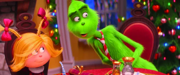 (from left) Cindy-Lou Who (Cameron Seely) helps liberate the Grinch (Benedict Cumberbatch) from his grumpiness in Dr. Seuss' The Grinch from Illumination.
