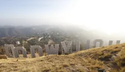 epa11799502 The Hollywood sign overlooks Mount Lee in Los Angeles, California, USA, 30 December 2024. The National Weather Service on 30 December issued an air quality alert for areas of Southern California along with the South Coast Air Quality Management District extending its a mandatory wood-burning ban for residents in the region. EPA/CAROLINE BREHMAN