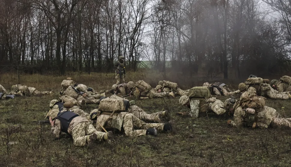 epa12588215 A handout photo made available by the press service of the 65th Separate Mechanized Brigade of the Ukrainian Armed Forces shows the recruits who take part in the short and intense march during their basic military training (BMT) in an undisclosed location in the Zaporizhzhia area, Ukraine, 12 December 2025, amid the ongoing Russian invasion. Basic Military Training is a mandatory course for all recruits in the Ukrainian Armed Forces, providing fundamental knowledge of tactics, firepower, and medical training, while developing marksmanship skills and adapting recruits to army life. Russian troops entered Ukrainian territory on 24 February 2022, starting a conflict that has provoked destruction and a humanitarian crisis. EPA/Press service of the 65th Mechanized Brigade HANDOUT HANDOUT EDITORIAL USE ONLY/NO SALES