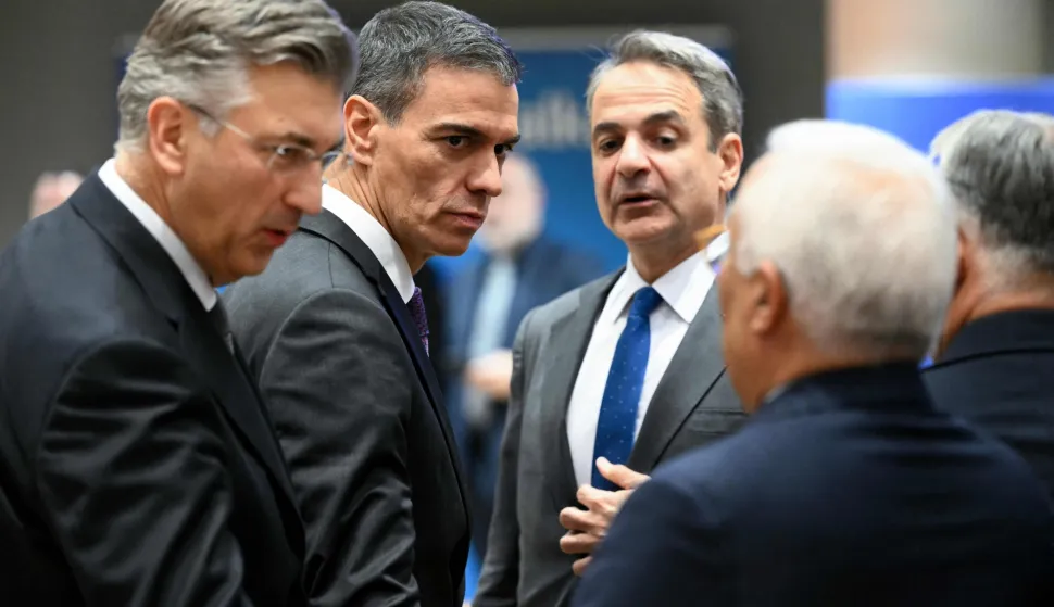 Croatia's Prime Minister Andrej Plenkovic, Spain's Prime Minister Pedro Sanchez and Greece's Prime Minister Kyriakos Mitsotakis speak prior to a roundtable as part of the EU Western Balkans summit in Brussels on December 17, 2025. (Photo by NICOLAS TUCAT/AFP)