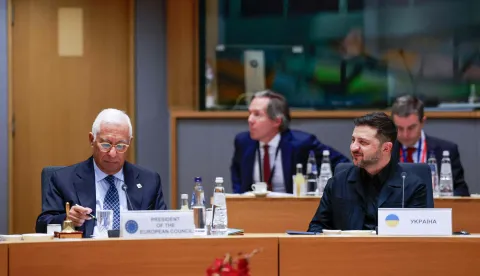Ukrainian President Volodymyr Zelensky (R) and European Council President Antonio Costa attend a EU summit in Brussels on December 18, 2025. EU leaders kicked off a make-or-break summit on December 18, 2025 on using frozen Russian assets to fund Ukraine, with key player Belgium under pressure to drop its opposition. (Photo by Stephanie Lecocq/POOL/AFP)